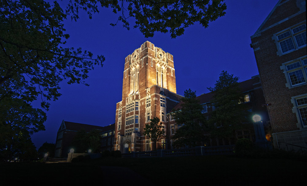 The iconic Ayres hall building lit by a floodlight at night
