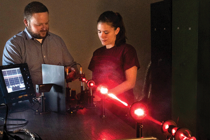 UT Knoxville’s Space Institute intern working with lasers.