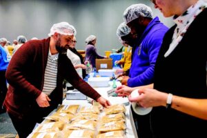 Students, staff, and faculty are volunteering to package meals that will be donated to the Big Orange Pantry and other select community organizations in Knoxville during an event called Pack to Give Back happening in the Student Union Ballroom as part of Hunger and Homelessness Awareness Week. Photos by Steven Bridges.